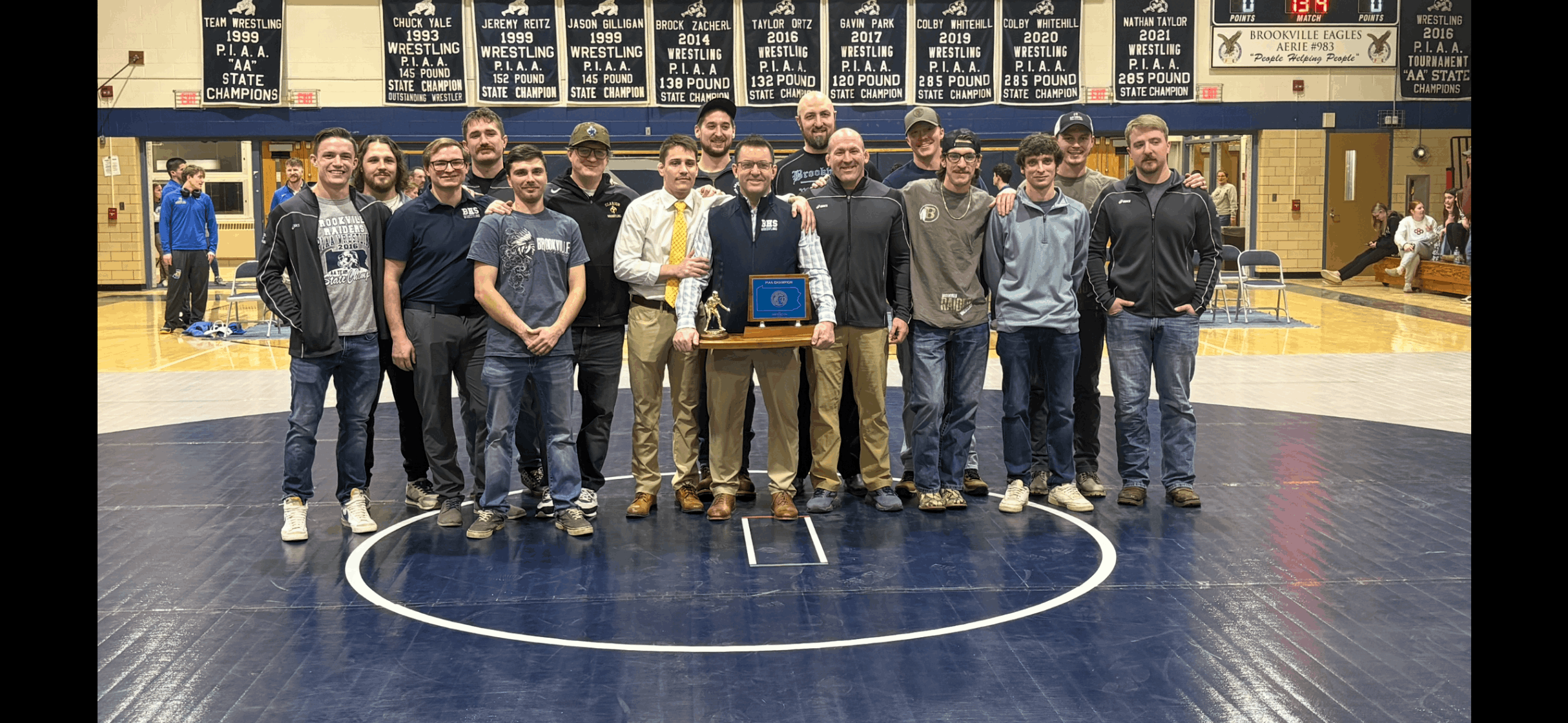 Members of the 2015-2016 championship wrestling team pose for a photo at a recent home meet.